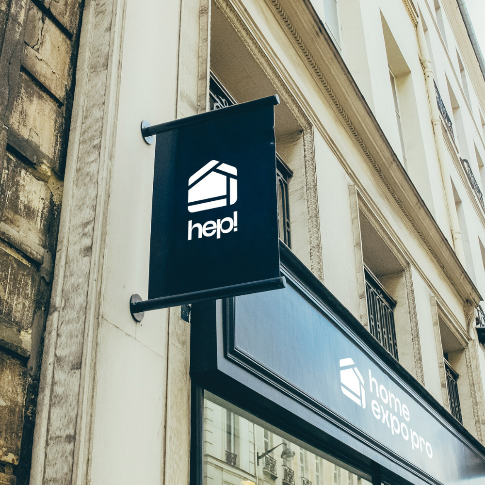 Enseigne de façade avec le logo abrégé « hep! » de Home Expo Pro
